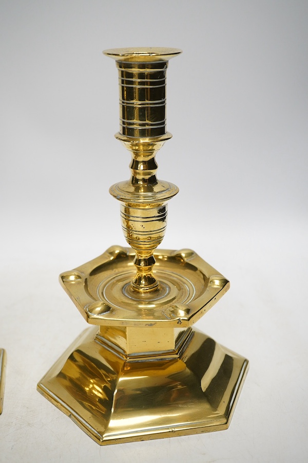 A pair of Dutch style 'Heemskerk' heavy cast brass candlesticks, on hexagonal bases, 24cm. Condition - fair to good